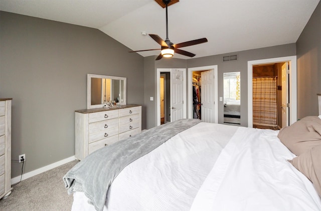 905 SE Meadowlark Dr, Grimes, IA 50111 - bedroom featuring light carpet, vaulted ceiling, a spacious closet, ensuite bath, and ceiling fan