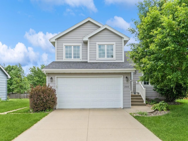 2015 NW 158th St, Clive, IA 50325 - traditional-style house featuring roof with shingles, a front yard, and driveway