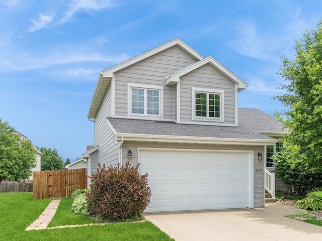 2015 NW 158th St, Clive, IA 50325 - traditional-style house with concrete driveway, roof with shingles, and an attached garage