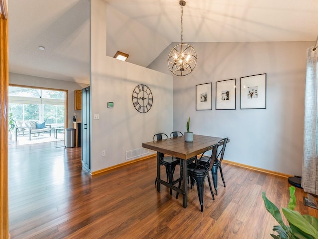 2015 NW 158th St, Clive, IA 50325 - dining space with a chandelier, wood finished floors, and lofted ceiling