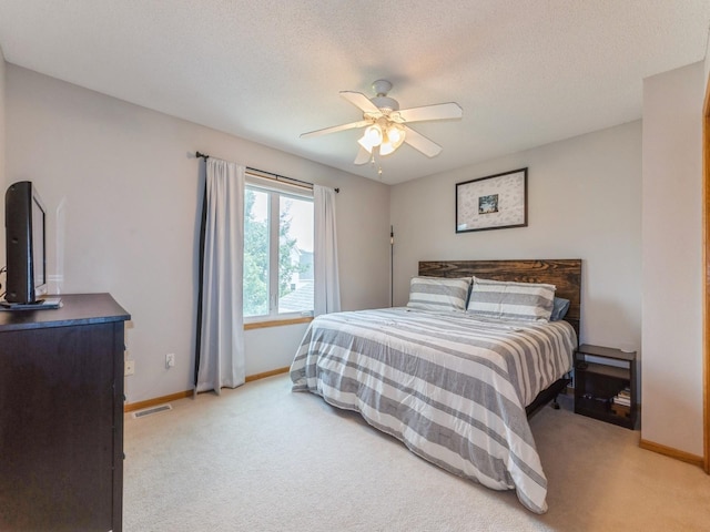 2015 NW 158th St, Clive, IA 50325 - bedroom featuring light colored carpet, ceiling fan, and a textured ceiling