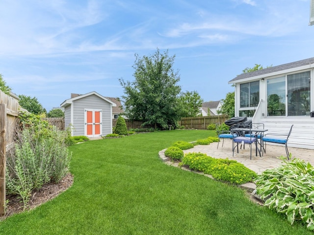 2015 NW 158th St, Clive, IA 50325 - fenced backyard featuring a storage unit and a patio area