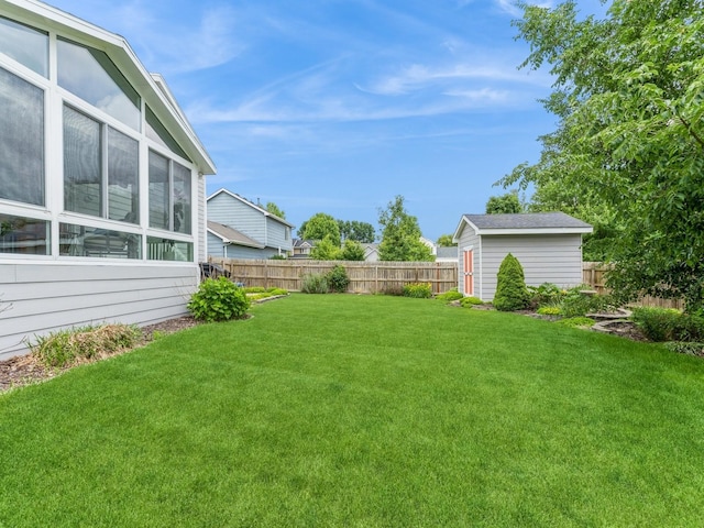 2015 NW 158th St, Clive, IA 50325 - fenced backyard featuring a storage unit and a sunroom