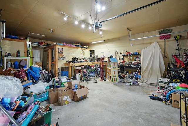 455 NW 2nd St, Earlham, IA 50072 - garage featuring a garage door opener and a workshop area