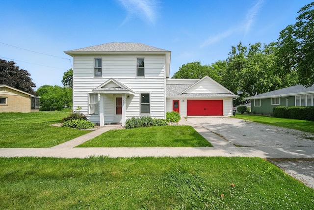 455 NW 2nd St, Earlham, IA 50072 - view of front of property featuring a garage, a front yard, asphalt driveway, and roof with shingles