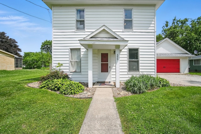 455 NW 2nd St, Earlham, IA 50072 - view of front of property featuring a front lawn, a garage, and driveway