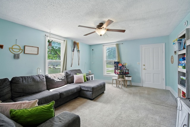 455 NW 2nd St, Earlham, IA 50072 - living room with ceiling fan, light colored carpet, and a textured ceiling