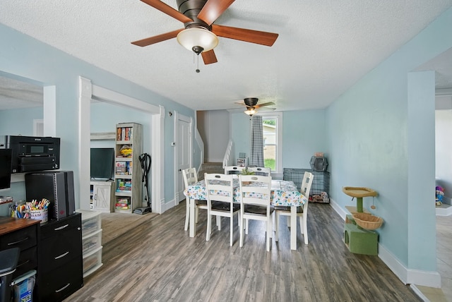 455 NW 2nd St, Earlham, IA 50072 - dining space featuring ceiling fan, wood finished floors, and a textured ceiling