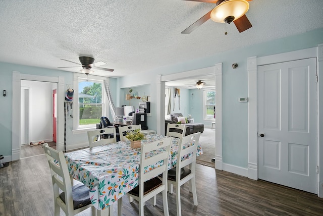 455 NW 2nd St, Earlham, IA 50072 - dining room featuring ceiling fan, dark wood-style flooring, and a textured ceiling