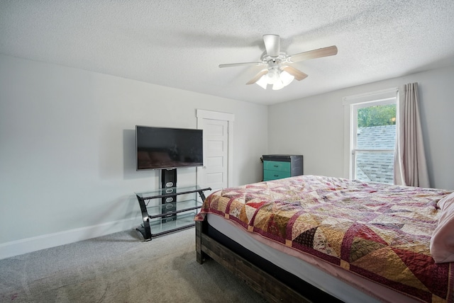 455 NW 2nd St, Earlham, IA 50072 - bedroom featuring carpet floors, a textured ceiling, and a ceiling fan
