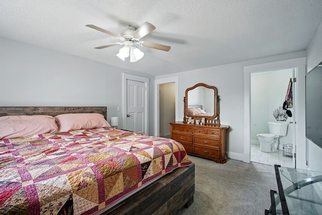 455 NW 2nd St, Earlham, IA 50072 - carpeted bedroom with a textured ceiling, connected bathroom, and ceiling fan