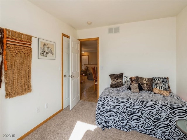 2005 E 1st Ave, Indianola, IA 50125 - bedroom with light colored carpet and baseboards