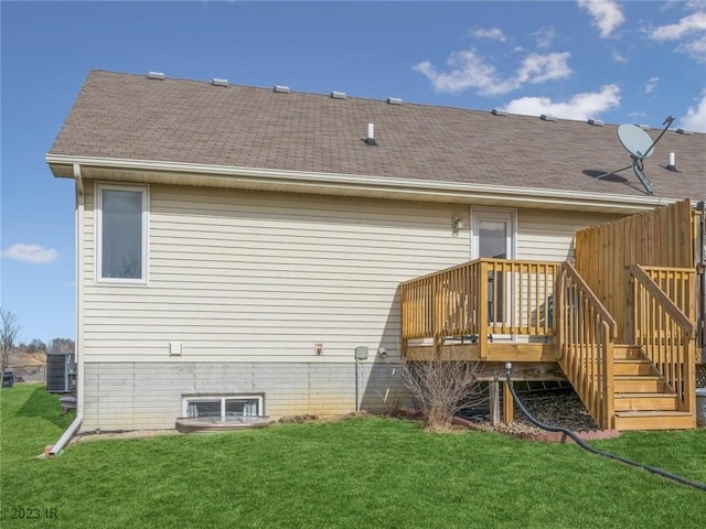 2005 E 1st Ave, Indianola, IA 50125 - back of house featuring a lawn, a wooden deck, and roof with shingles