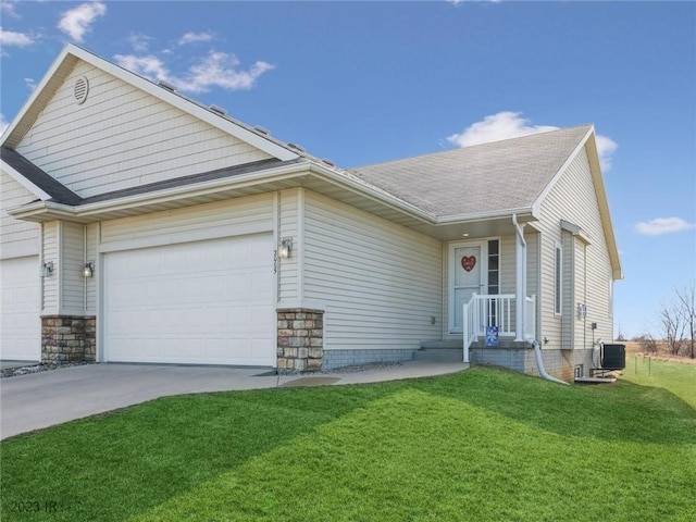 2005 E 1st Ave, Indianola, IA 50125 - view of front of house with driveway, a front yard, a garage, and a shingled roof