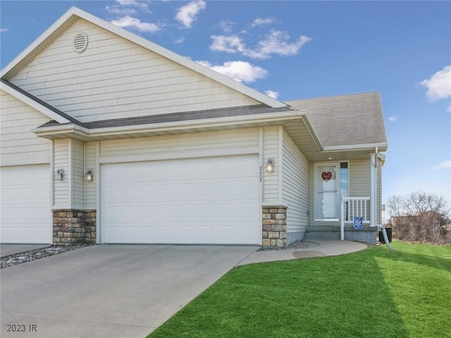 2005 E 1st Ave, Indianola, IA 50125 - view of front facade with driveway, a garage, stone siding, and roof with shingles