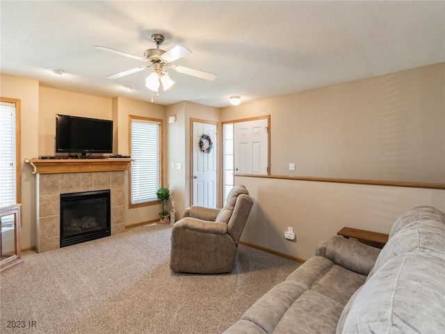 2005 E 1st Ave, Indianola, IA 50125 - carpeted living room featuring ceiling fan and a fireplace