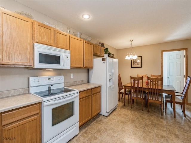 2005 E 1st Ave, Indianola, IA 50125 - kitchen with white appliances, a chandelier, light countertops, hanging light fixtures, and recessed lighting