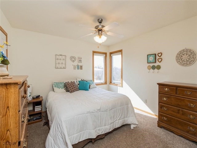 2005 E 1st Ave, Indianola, IA 50125 - bedroom featuring carpet floors and a ceiling fan