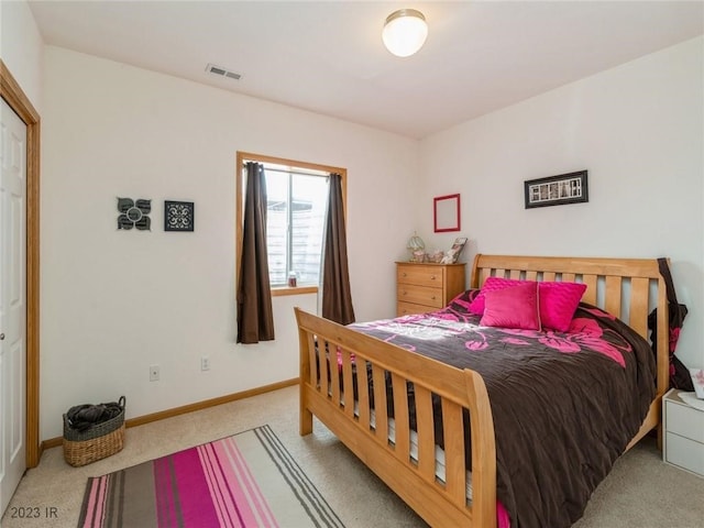 2005 E 1st Ave, Indianola, IA 50125 - bedroom with carpet floors and baseboards