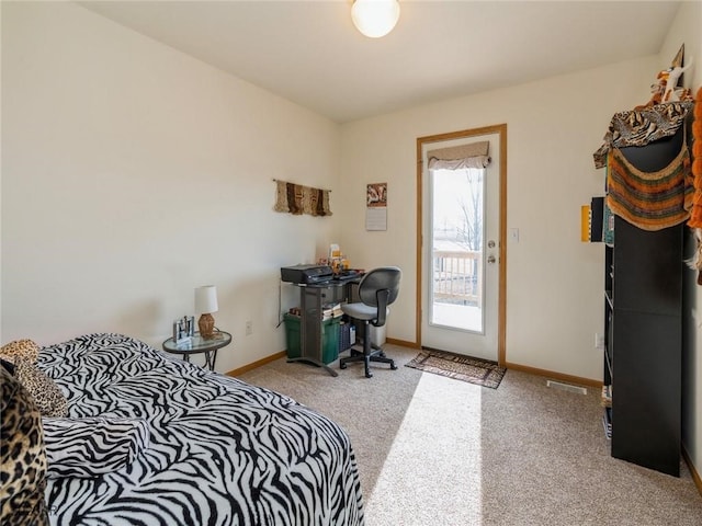2005 E 1st Ave, Indianola, IA 50125 - bedroom with carpet and baseboards