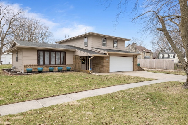 102 Kellogg Ave, Dallas Center, IA 50063 - tri-level home with brick siding, driveway, an attached garage, and roof with shingles