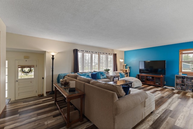 102 Kellogg Ave, Dallas Center, IA 50063 - living room featuring a textured ceiling and wood finished floors
