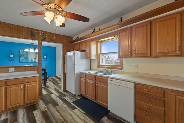 102 Kellogg Ave, Dallas Center, IA 50063 - kitchen featuring white appliances, dark wood-style flooring, brown cabinets, and light countertops