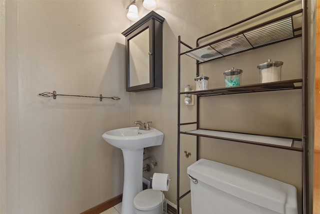 102 Kellogg Ave, Dallas Center, IA 50063 - half bath featuring toilet and baseboards