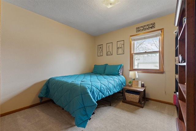 102 Kellogg Ave, Dallas Center, IA 50063 - carpeted bedroom with a textured ceiling and baseboards