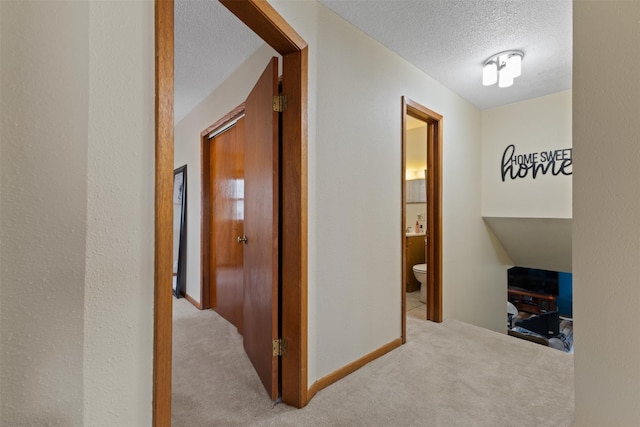 102 Kellogg Ave, Dallas Center, IA 50063 - corridor with a textured ceiling and carpet