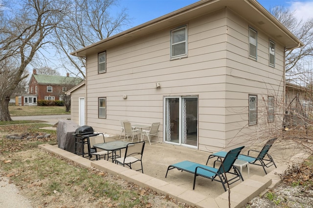 102 Kellogg Ave, Dallas Center, IA 50063 - back of house with a patio
