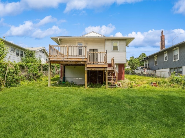 3324 Rollins Ave, Des Moines, IA 50312 - rear view of house featuring a deck, stairway, and a fenced backyard