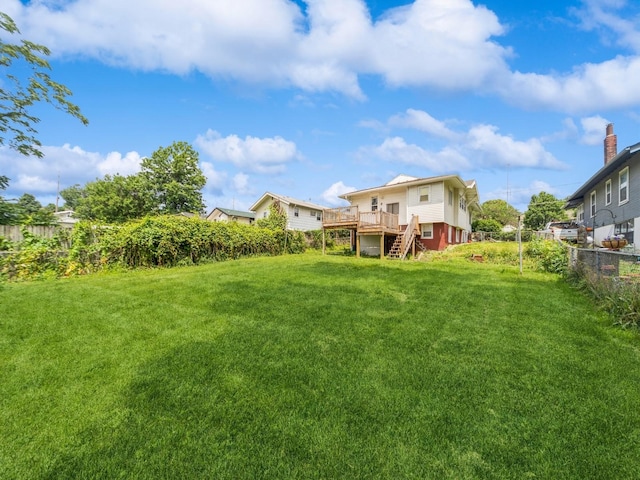 3324 Rollins Ave, Des Moines, IA 50312 - fenced backyard with stairs and a wooden deck