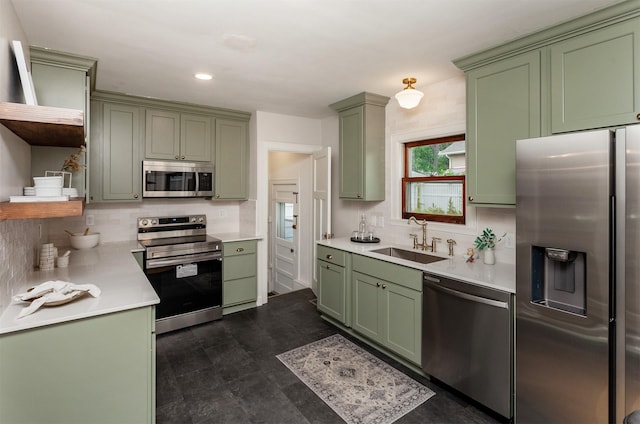 16 E Leach Ave, Des Moines, IA 50315 - kitchen featuring green cabinets, appliances with stainless steel finishes, open shelves, backsplash, and recessed lighting