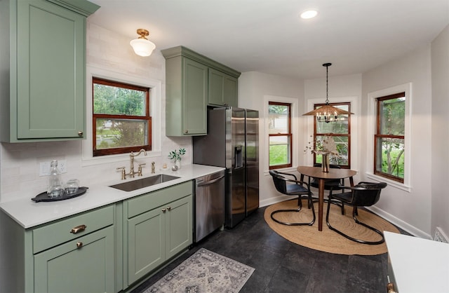 16 E Leach Ave, Des Moines, IA 50315 - kitchen with green cabinetry, stainless steel appliances, and recessed lighting