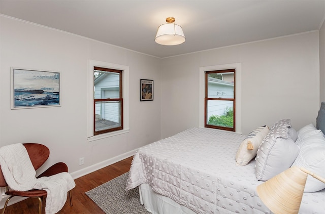 16 E Leach Ave, Des Moines, IA 50315 - bedroom featuring dark wood-type flooring and ornamental molding