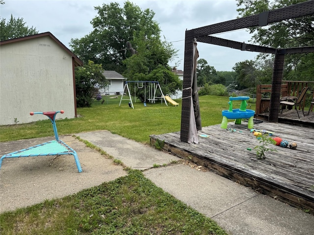 2601 Sherwood Dr, Des Moines, IA 50310 - view of yard with a deck and a playground