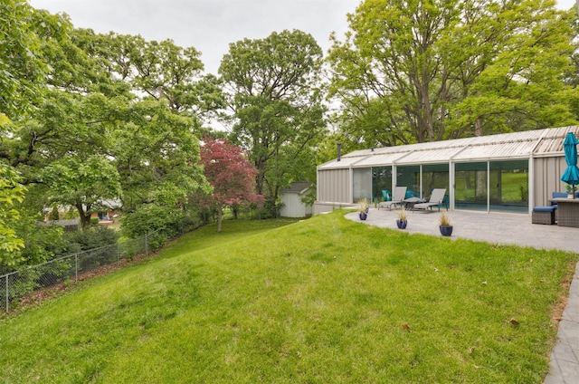 6771 College Ave, Windsor Heights, IA 50324 - view of yard featuring a patio area and view of scattered trees