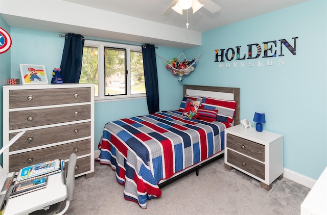 6771 College Ave, Windsor Heights, IA 50324 - carpeted bedroom featuring a ceiling fan