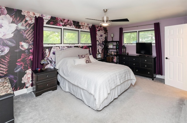 6771 College Ave, Windsor Heights, IA 50324 - carpeted bedroom featuring a ceiling fan
