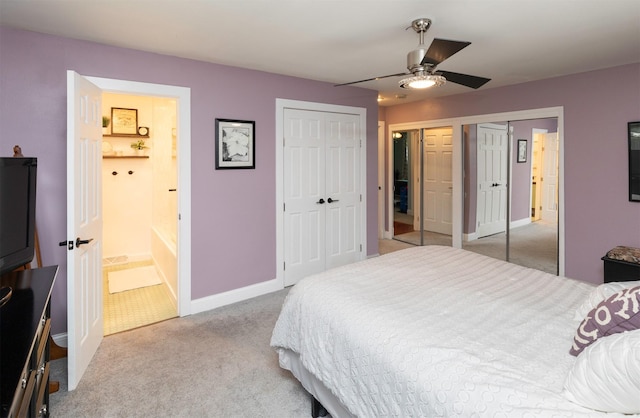 6771 College Ave, Windsor Heights, IA 50324 - bedroom featuring carpet, two closets, connected bathroom, and ceiling fan