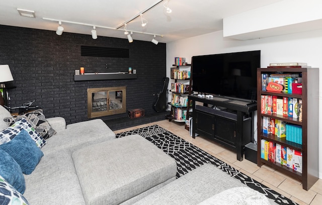 6771 College Ave, Windsor Heights, IA 50324 - tiled living area with a brick fireplace and track lighting