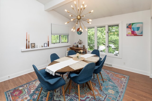 6771 College Ave, Windsor Heights, IA 50324 - dining space featuring wood finished floors and a chandelier
