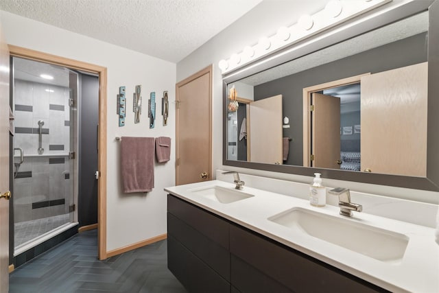 4210 Beaver Hills Dr, Des Moines, IA 50310 - full bath featuring a shower stall, double vanity, a textured ceiling, and ensuite bathroom