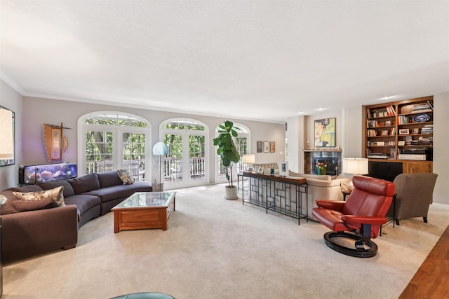 4210 Beaver Hills Dr, Des Moines, IA 50310 - living room with crown molding, a fireplace, and built in shelves