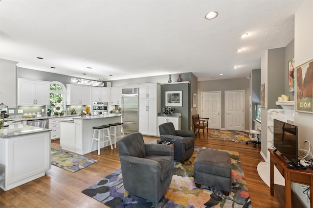 4210 Beaver Hills Dr, Des Moines, IA 50310 - living area featuring wood finished floors and recessed lighting