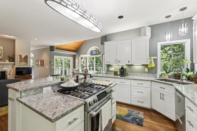 4210 Beaver Hills Dr, Des Moines, IA 50310 - kitchen with stainless steel appliances, a center island, dark wood-type flooring, white cabinetry, and open floor plan