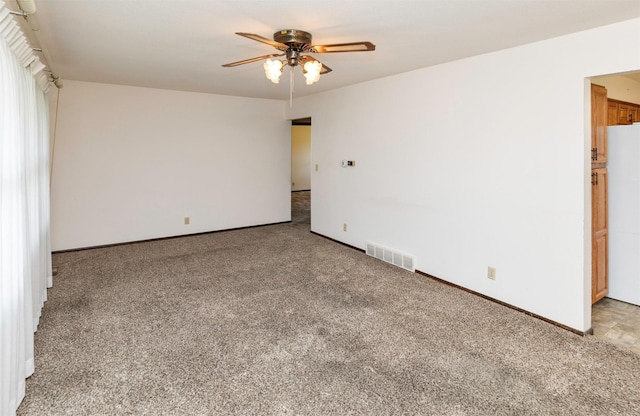 460 N 9th St, Carlisle, IA 50047 - spare room featuring a ceiling fan and carpet flooring