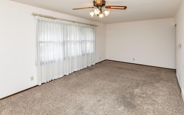 460 N 9th St, Carlisle, IA 50047 - carpeted empty room featuring ceiling fan and baseboards