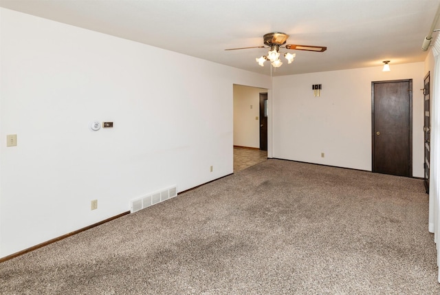 460 N 9th St, Carlisle, IA 50047 - spare room featuring carpet floors and a ceiling fan